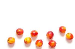 Ripe nectarines isolated on white background with copy space for your text. Top view. - Image photo