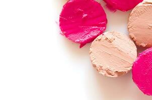 Sliced  lipstick sample on white background, flat lay.  - Image photo