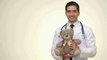 Children's doctor is holding a teddy bear video