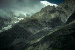 Mont Blanc mountain range under the snow in Valle d'Aosta in Courmayeur, in the summer of 2023 photo