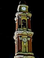 bell tower of the church of the historic center of cairo montenotte during the festival of medieval cairo in august 2023 photo