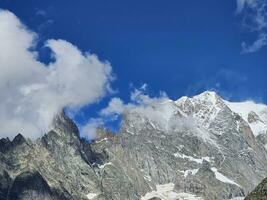 Mont Blanc mountain range under the snow in Valle d'Aosta in Courmayeur, in the summer of 2023 photo