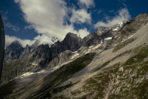 the Mont Blanc mountain range seen from Punta hellbronner in July 2023 under the snow photo