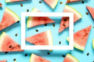 Fresh red watermelon slice Isolated light blue background.  Summer concept.Top view, Flat lay, Copy space. - Image photo