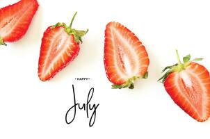 Inscription Happy July. Creative fresh strawberries pattern background. - Image photo