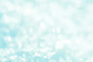 Snow sparkle background. Abstract blue bokeh background. photo