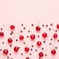 Cherry and blueberry on pink background. Flat lay, top view. Copy space.- Image photo