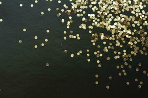 Gold sparkles glitter. Glitter glow festive sparkles design. photo