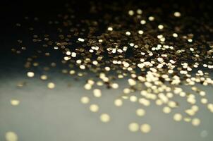 Gold sparkles glitter. Glitter glow festive sparkles design. photo