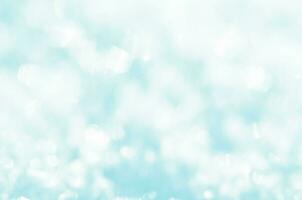 Snow sparkle background. Abstract blue bokeh background. photo
