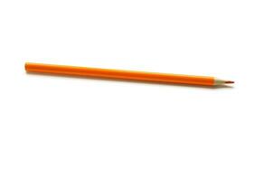 Orange color pencil on white background. - Image photo