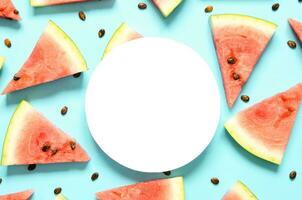 Fresh red watermelon slice Isolated light blue background.  Summer concept.Top view, Flat lay, Copy space. - Image photo