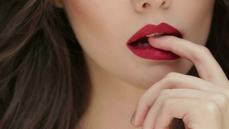Close up finger on the lips of a young girl 32038638 Stock Video at