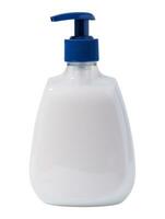 White plastic transparent bottle with soap dispenser on a white background photo