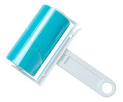 Roller with sticky tape for cleaning clothes on a white background, top view photo