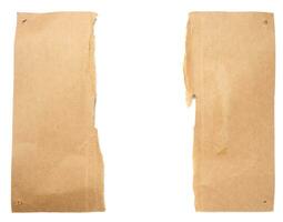 Torn brown cardboard sheet of paper with torn edges, copy space photo