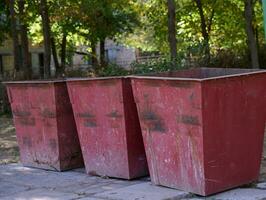 Empty metal trash cans in the park photo