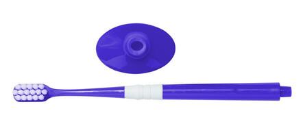Blue plastic toothbrush and stand on white isolated background, top view photo