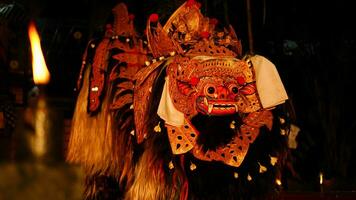 Barong dance staged to celebrate Saraswati's feast day, night day. Balinese dance and dancer, spooky photo