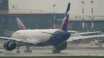 MOSCOW, RUSSIAN FEDERATION JULY 30, 2021 - Boeing 777 of Aeroflot accelerating for takeoff at Sheremetyevo airport, rear view video