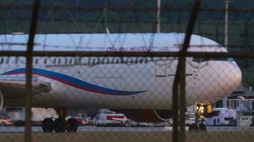 PHUKET, THAILAND JANUARY 23, 2023 - Boeing 767 of Sunday Airlines taxiing at Phuket airport. Footage of airplane on the taxiway. Apron, plane video