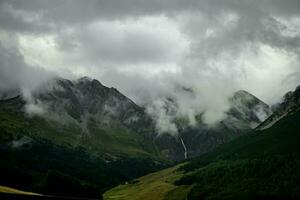 snow-filled mountain tops after a summer snowfall, in Livigno, Valtellina in the summer of 2023 photo