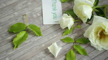 small bouquet of beautiful white summer roses, on a wooden table video