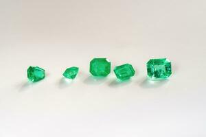 Emeralds on white background photo