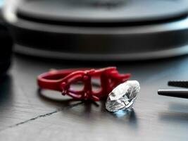 Diamond on jeweler table photo