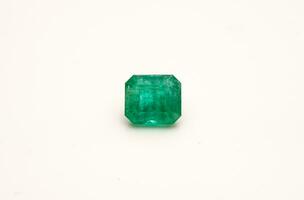 Natural emeralds on white background photo