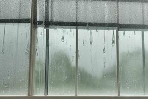 drops of rain on a window glass background. AI Generative Pro Photo