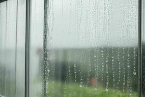 drops of rain on a window glass background. AI Generative Pro Photo