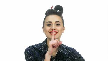 Young pin-up woman put finger to her mouth and say shhh video