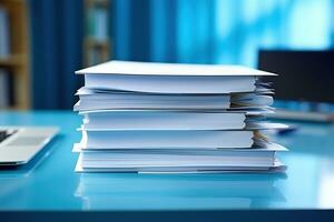 A large stack of papers on the desktop. photo