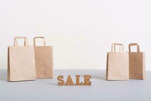 Green Friday sale lettering and paper bags on table photo