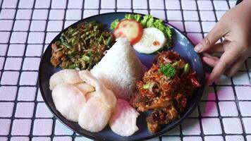 Rice with fried chicken. Indonesia tradisional food video