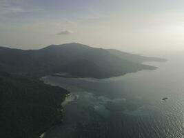 Aerial view of Karimunjawa Islands, Jepara, Indonesian archipelago, Volcano Island, coral reefs, white sand beaches. Top tourist destination, best diving snorkelling. photo