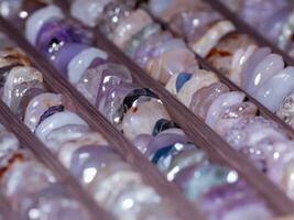 beautiful colorful beads on a table. photo