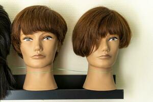 A mannequin with hair for teaching the art of a hairdresser photo