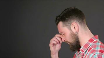 Bearded guy ponders a problem video
