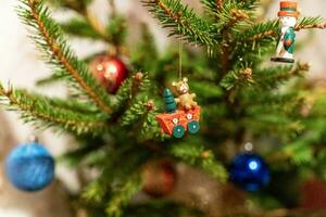 Christmas tree toys on the branches of the Christmas tree. photo