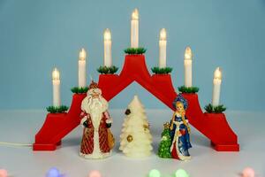 Santa Claus, Snow Maiden and Christmas tree. Celebrating the New Year photo