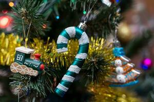 Wooden train, caramel cane. The concept of celebrating Christmas photo