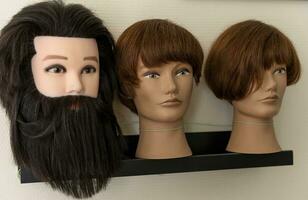 A mannequin with hair for teaching the art of a hairdresser photo