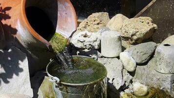 Waterfall flowing from Pot to Bucket video