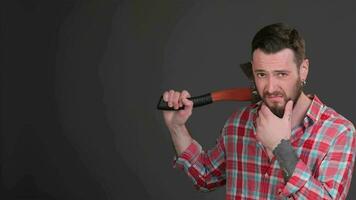 Bearded hipster puts an ax on his shoulder video