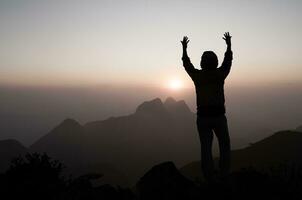 Silhouette of Human hands open palm up worship. Eucharist Therapy Bless God Helping Repent Catholic Easter Lent Mind Pray. Christian Religion concept background. fighting and victory for god. photo