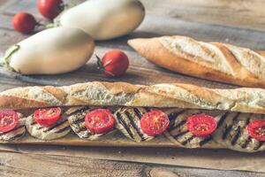 Sandwich with grilled aubergines and cherry tomatoes photo