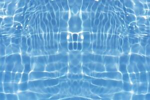 Defocus blurred transparent blue colored clear calm water surface texture with splashes reflection. Trendy abstract nature background. Water waves in sunlight with copy space. Blue watercolor shine. photo