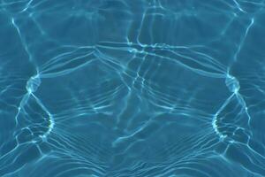Defocus blurred transparent blue colored clear calm water surface texture with splashes reflection. Trendy abstract nature background. Water waves in sunlight with copy space. Blue watercolor shine. photo